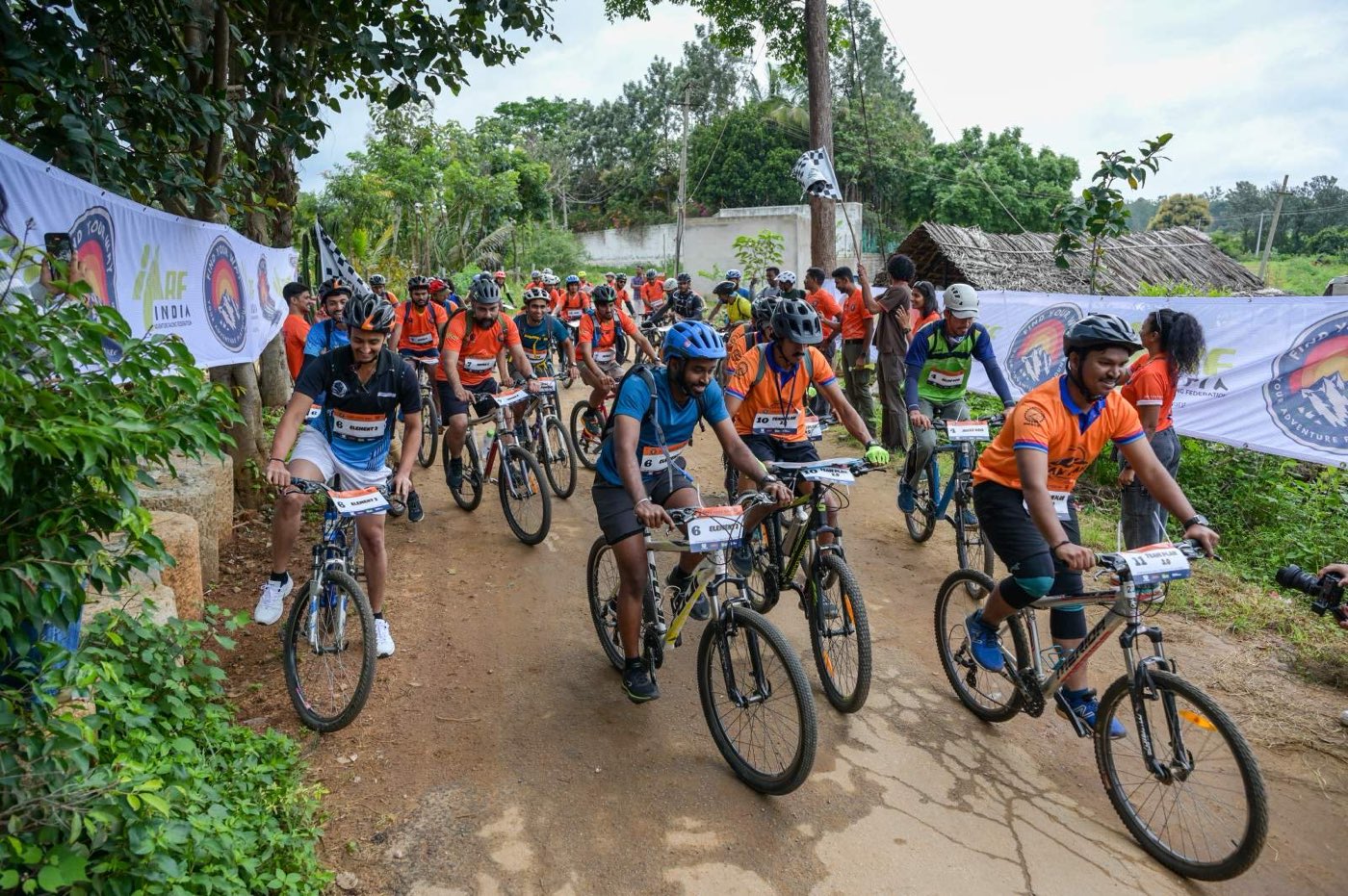 Cyclists setting off from the start line of an adventure race